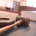 A wooden gavel in a courtroom, file photo